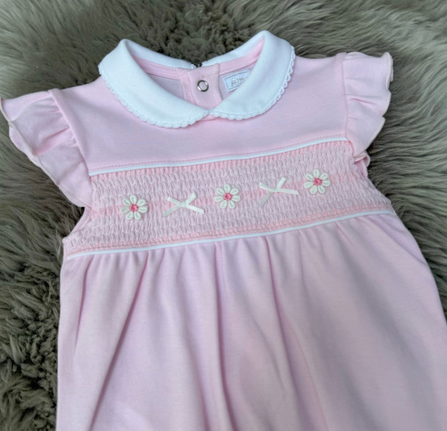 Pink daisy smock romper