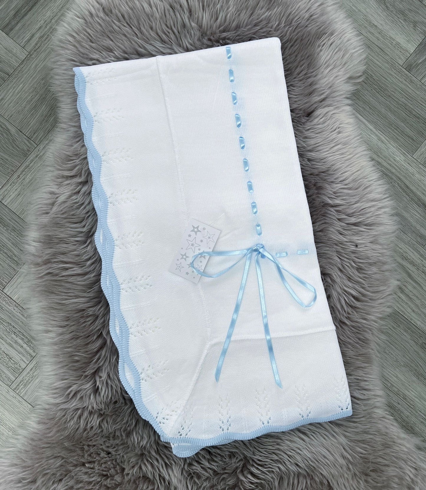 White Blanket With Blue Bow