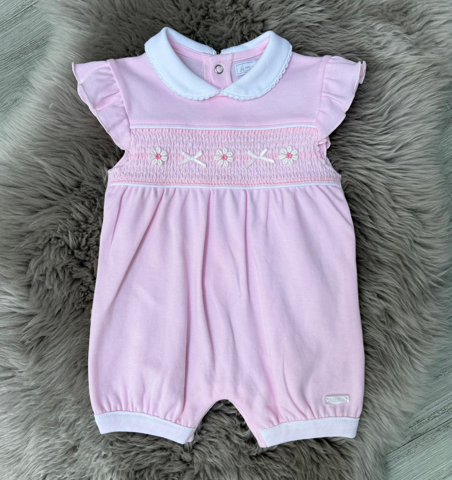 Pink daisy smock romper
